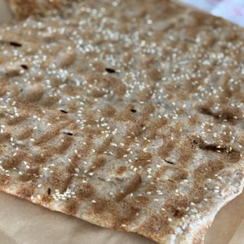 Honey Bakery & Cafe - a piece of bread on a piece of paper - Bakeries Near Me - San Jose, California