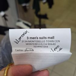 3 mens suits  - El recibo de la cajera despota que nos atendió.