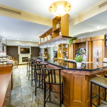 Pomodoro Ristorante - a kitchen with a bar - Italian Near Me - Oakville, Ontario Pomodoro Ristorante - a kitchen with a bar - Italian Near Me - Oakville, Ontario