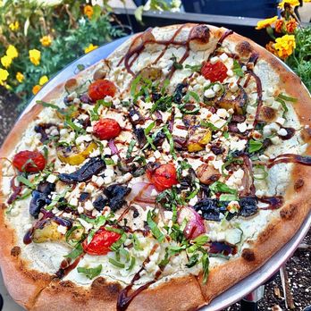 Wise Guys Downtown - a pizza with toppings on it - Italian Near Me - Huntington, Indiana