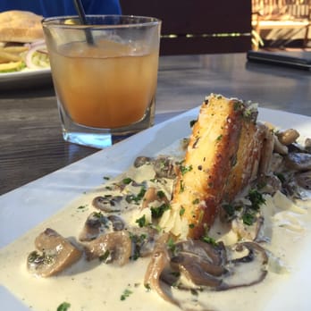 The Hideout - Polenta with mushrooms. The Frazier cocktail in the background - Cocktail Bars Near Me - Aptos, California The Hideout - Polenta with mushrooms. The Frazier cocktail in the background - Cocktail Bars Near Me - Aptos, California