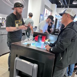 Alex and my hubby having conversations on Oakley glasses