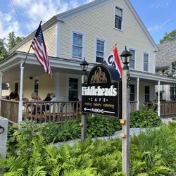 From street, outdoor seating on wraparound porch and patio in back. Indoor seating is air conditioned.