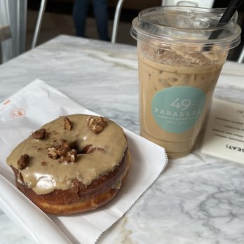 49th Parallel Coffee - maple nut doughnut & venezulean iced coffee - Coffee & Tea Near Me - Vancouver, British Columbia 49th Parallel Coffee - maple nut doughnut & venezulean iced coffee - Coffee & Tea Near Me - Vancouver, British Columbia