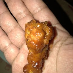 a hand holding a piece of food