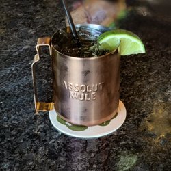 R Bar & Grill - Classic Moscow Mule served over ice with a fresh lime garnish.