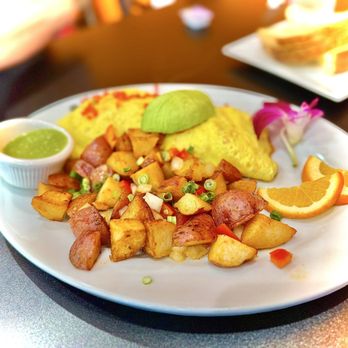 Calafia Kitchen - Delicious Calafia Benedict with verde salsa and country potatoes. - Breakfast & Brunch Near Me - Livermore, California