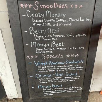 Ani's Bagel Cafe - Smoothie Menu - A chalkboard menu displays smoothie options and specials, including veggie rainbow sandwich, orange and beet salad, and Asian bowl. - Bagels Near Me - Exeter, New Hampshire