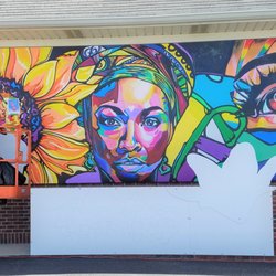 In Bloom - In Bloom 2021 by Nekoda Witsken on the north wall of the Jiffy Lube located on N Michigan road beween Zionsville and Carmel.