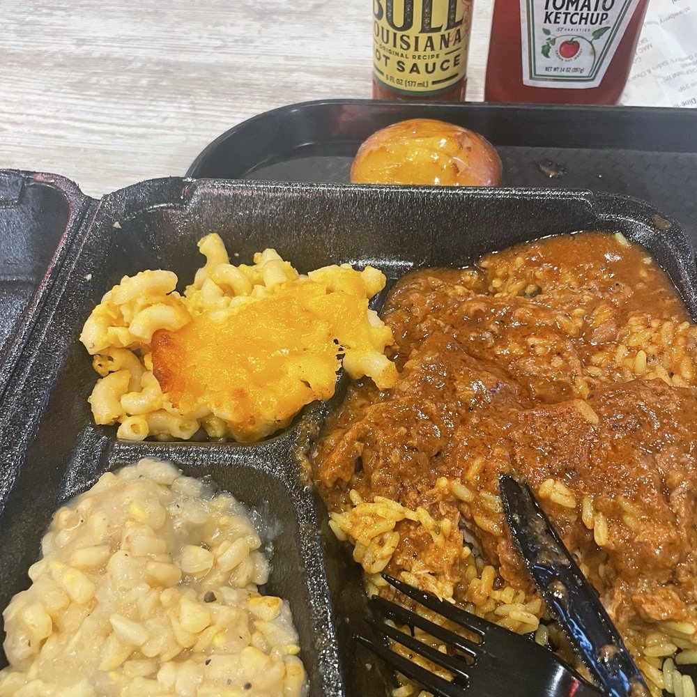Mac & Cheese, white corn, smothered Pork Chop over rice and cornbread muffin. Mac & Cheese, white corn, smothered Pork Chop over rice and cornbread muffin.