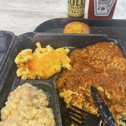 Mac & Cheese, white corn, smothered Pork Chop over rice and cornbread muffin. Mac & Cheese, white corn, smothered Pork Chop over rice and cornbread muffin.