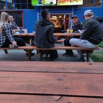 Satellite Tavern - a group of people sitting at a picnic table - Sports Bars Near Me - Portland, Oregon Satellite Tavern - a group of people sitting at a picnic table - Sports Bars Near Me - Portland, Oregon