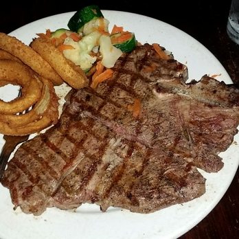 Hunter Steakhouse - That's what a medium cooked Porterhouse steak looks like...sorry you can't actually taste the juiciness & tenderness &  melts in my mouth - Steakhouses Near Me - Oceanside, California