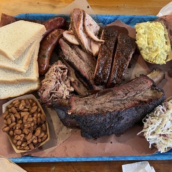 Franklin Barbecue - House sausage, jalapeno sausage, smoked turkey, pork ribs, brisket, pulled pork, beef rib, potato salad, beans, and cole slaw! - Barbeque Near Me - Austin, Texas Franklin Barbecue - House sausage, jalapeno sausage, smoked turkey, pork ribs, brisket, pulled pork, beef rib, potato salad, beans, and cole slaw! - Barbeque Near Me - Austin, Texas