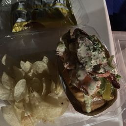 Monster lobster roll comes with chips. Not a good picture but a delicious roll.