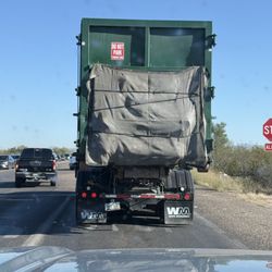 Waste Management - Bad truck, bad tie down that lead to trash falling out in a National Park!