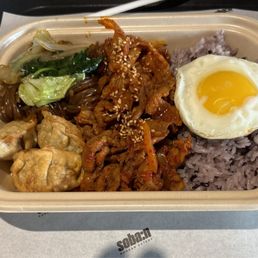 Mandu, Japchae, Spicy Pork, Purple Rice & Fried Egg.