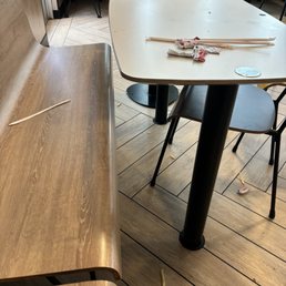 Tables full of trash and no one's cleared them. People  have to wipe down and clean their own tables after other parties have left.