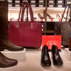 Cole Haan - Boots for ladies, short or tall!  Casual bags an yes they have leather options available in different colors.