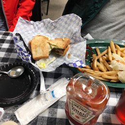 a sandwich and fries on a table