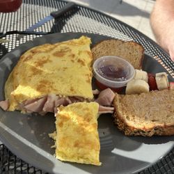 Paradise Bagels Cafe - Omelette with ham and cheese. The picture does not do it justice. This thing was HUGE!