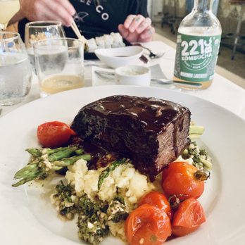 Lila - Bison short ribs over asparagus, chimichurri, mashed potatoes, and tomatoes - New American Near Me - Sarasota, Florida