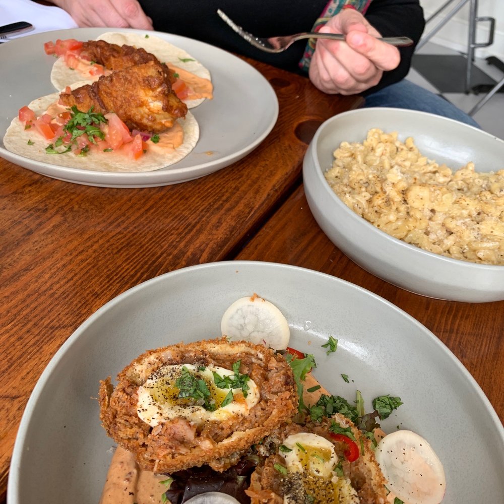 The Social - two plates of food on a table - Pubs Near Me - Port Hope, Ontario The Social - two plates of food on a table - Pubs Near Me - Port Hope, Ontario