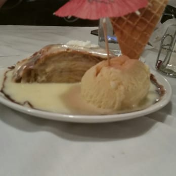 The German Deli and Jagerstuble - Apple strudel with vanilla sauce, vanilla ice cream and a pink umbrella! - Grocery Near Me - Largo, Florida The German Deli and Jagerstuble - Apple strudel with vanilla sauce, vanilla ice cream and a pink umbrella! - Grocery Near Me - Largo, Florida