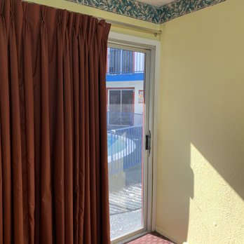 Relax Inn - Curtains opened up to reveal pool area - Hotels Near Me - Copperas Cove, Texas Relax Inn - Curtains opened up to reveal pool area - Hotels Near Me - Copperas Cove, Texas