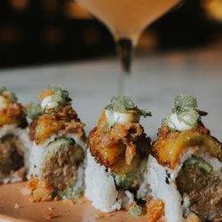 Chandelier Bar - Savor Sushi and signature cocktails, served beneath the radiant aura of our famous Czechoslovakian crystal centerpiece.