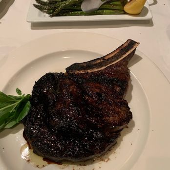 The Capital Grille - Porcini-Rubbed Bone-In Ribeye* - Steakhouses Near Me - Troy, Michigan The Capital Grille - Porcini-Rubbed Bone-In Ribeye* - Steakhouses Near Me - Troy, Michigan