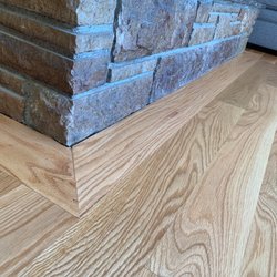 John Robbins Flooring - Trimmed in area around stone hearth