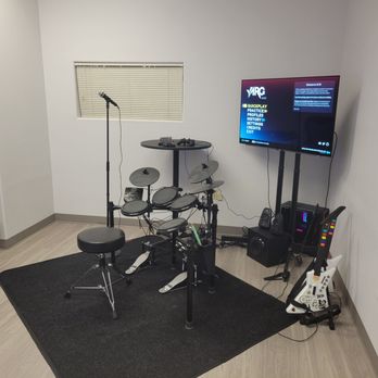 Red Note Rhythm Games - YARG with 2 guitars, microphone, and electric drum set - Arcades Near Me - Las Vegas, Nevada