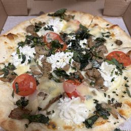 Personal 10" white pizza with sausage, onion, mushrooms, basil, tomatoes, and ricotta cheese with mozzarella and Parmesan.