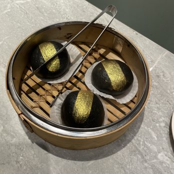 Supreme Dumplings - Dessert  Charcoal gold lava custard bun w/ gold flakes - Shanghainese Near Me - Kirkland, Washington