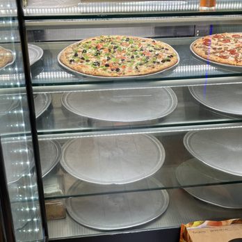 99 Cent Delicious Pizza - pizzas in a display case - Pizza Near Me - New York, New York 99 Cent Delicious Pizza - pizzas in a display case - Pizza Near Me - New York, New York