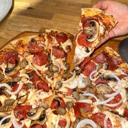 La Quinta Pizza - Rosa's 5 million dollar pizza is topped with pepperoni, sausage, onions, and mushrooms