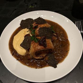Crawford & Son - Chef special French sausages en croute with shaved truffle, fois gras, pureed rutabaga and some dort of french onion sauce. - New American Near Me - Raleigh, North Carolina
