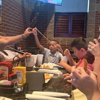 Jonathan's Grille - Look at this cheese pull!!! - Sports Bars Near Me - Spring Hill, Tennessee Jonathan's Grille - Look at this cheese pull!!! - Sports Bars Near Me - Spring Hill, Tennessee