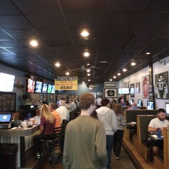 Sportspage Bar & Grille - Bar to left with booth seating to right - American Near Me - Midlothian, Virginia Sportspage Bar & Grille - Bar to left with booth seating to right - American Near Me - Midlothian, Virginia