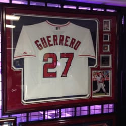 Sports Authentics - Custom framed jerseys can also be accompanied with pins, photos, or any extra additions that you would like to have framed..