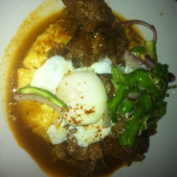 Jack Allen's Kitchen - Braised lamb shank over cheesy grits with poached egg and shishito peppers .... All just melts in your mouth :) - Southern Near Me - Round Rock, Texas Jack Allen's Kitchen - Braised lamb shank over cheesy grits with poached egg and shishito peppers .... All just melts in your mouth :) - Southern Near Me - Round Rock, Texas