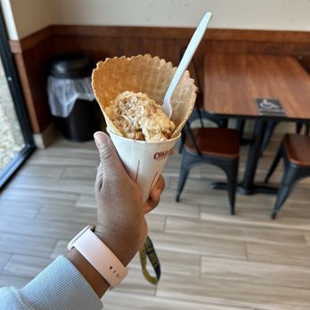 Cold Stone Creamery - a hand holding a cone of ice cream - Ice Cream & Frozen Yogurt Near Me - Palmdale, California