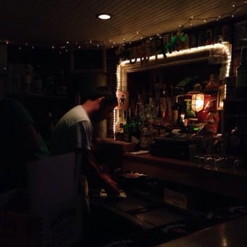 Showtime Lounge - a man preparing a drink in a dimly lit bar - Dive Bars Near Me - Washington, DC, District of Columbia Showtime Lounge - a man preparing a drink in a dimly lit bar - Dive Bars Near Me - Washington, DC, District of Columbia