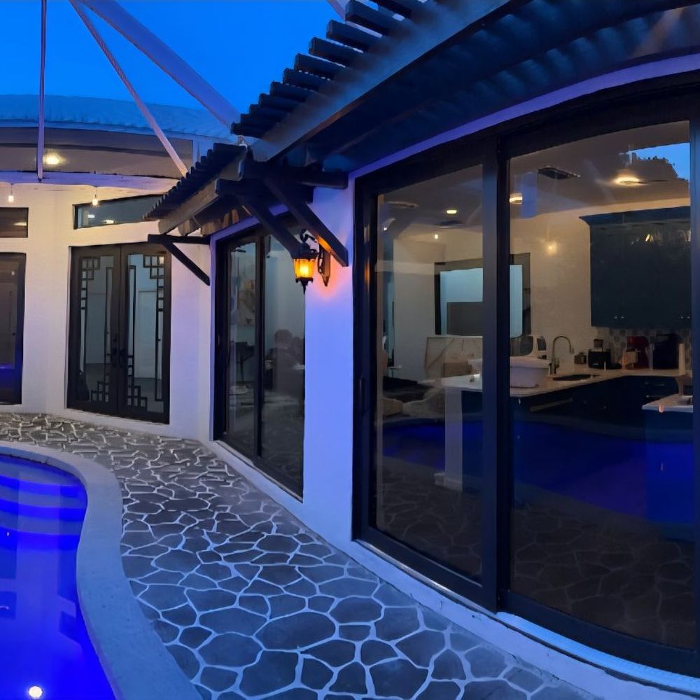 Boca Impact Window and Door - After picture of new bronze hurricane proof doors and glass - Windows Installation Near Me - Boca Raton, Florida Boca Impact Window and Door - After picture of new bronze hurricane proof doors and glass - Windows Installation Near Me - Boca Raton, Florida
