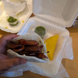 Chorizo arepas with chicken empanadas and their Verde sauce. Chorizo arepas with chicken empanadas and their Verde sauce.