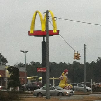 McDonald's - a man on a skateboard in front of a mcdonald's sign - Coffee & Tea Near Me - Conway, South Carolina