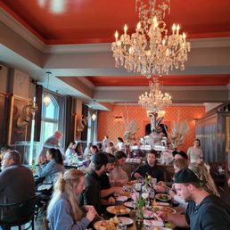 a large group of people eating a large group of people eating