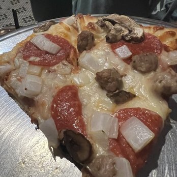 Brady's Bar - Sausage, pepperoni, mushroom, and onion pizza. - American Near Me - Traverse City, Michigan Brady's Bar - Sausage, pepperoni, mushroom, and onion pizza. - American Near Me - Traverse City, Michigan
