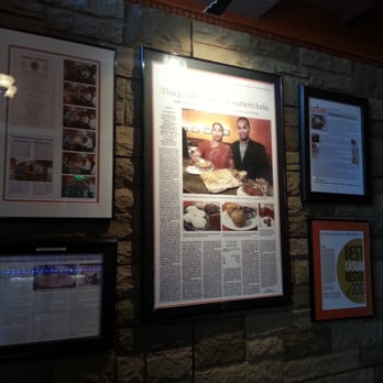 Thanjai - Framed articles and reviews at entrance - Indian Near Me - Montreal, Quebec